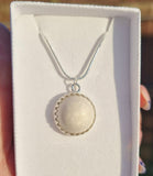 Oval breastmilk pendant with Sterling Silver bezel and chain, choice of opal glitters