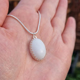 Oval breastmilk pendant with Sterling Silver bezel and chain, choice of opal glitters