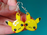 Selection of hand painted pokemon charms as either keychains, pin badges or jewellery sets