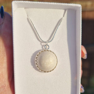 Ecopoxy Circle Breastmilk pendant with sterling silver bezel and chain, choice of opal glitters