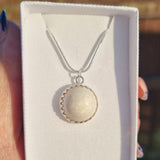 Ecopoxy Circle Breastmilk pendant with sterling silver bezel and chain, choice of opal glitters