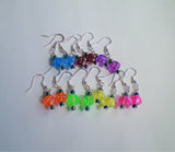 Dice and meeple earrings in a variety of bright colours, geeky nerd jewelry