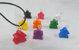 Dice and meeple earrings in a variety of bright colours, geeky nerd jewelry