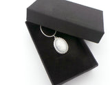 Oval breastmilk pendant with Sterling Silver bezel and chain, choice of opal glitters