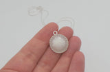 Ecopoxy Circle Breastmilk pendant with sterling silver bezel and chain, choice of opal glitters