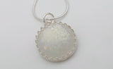 Ecopoxy Circle Breastmilk pendant with sterling silver bezel and chain, choice of opal glitters