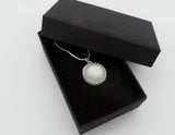 Ecopoxy Circle Breastmilk pendant with sterling silver bezel and chain, choice of opal glitters